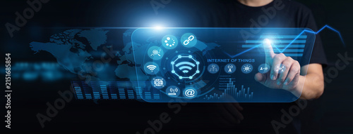 Fotografie Network technician using modern interface for Internet of Things