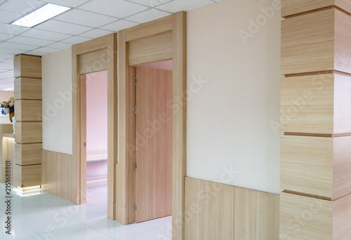 Modern hospital corridor wood door hallway interior clean bright clinical space
