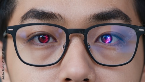 Close-up Portrait of a Young Man with Unique Red and Blue Eyes