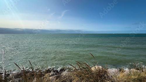 Konstfotografi Panoramic sea view over the English Channel with coastal dune grass and distant