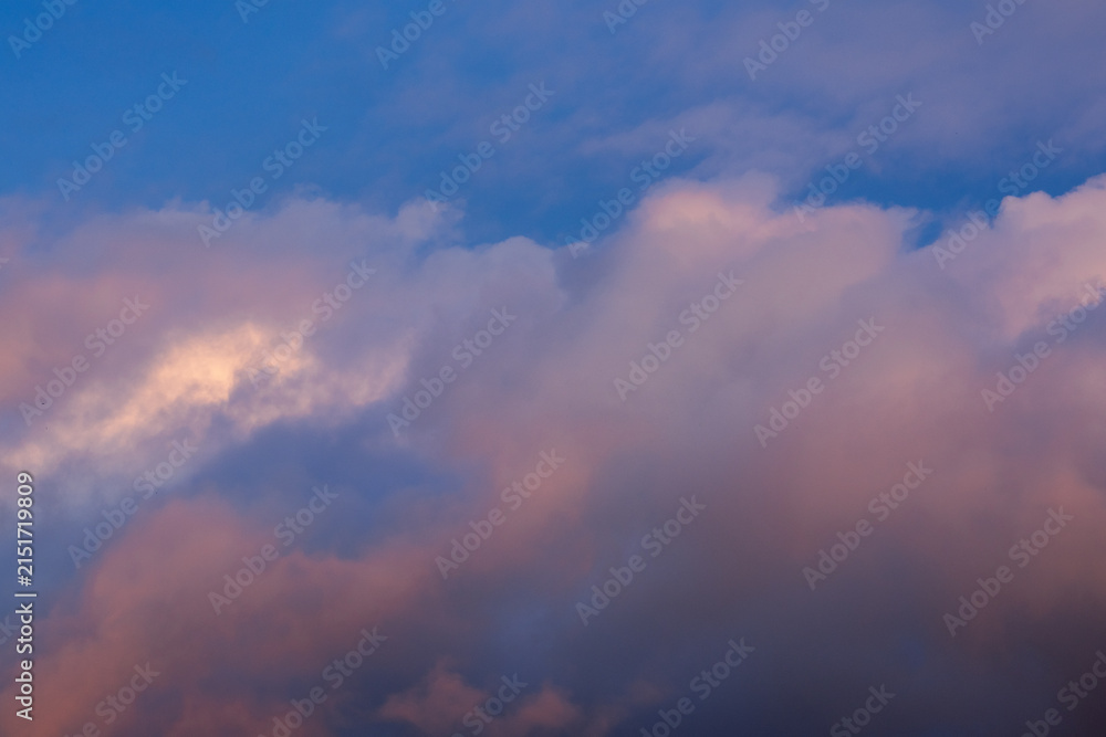 Obraz premium Dramatic Sunset Clouds Against Blue Sky