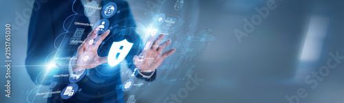 Security manager touching virtual screen with protection icons for Information Security, defending data, devices, policies, risks, access, and company systems from digital threats daily.