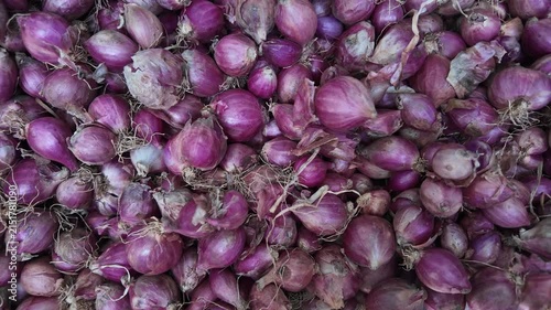fresh shallots dropping on  Surface, onion market , slow motion