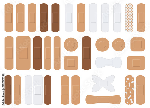 Set of adhesive bandages in various skin tones. 
