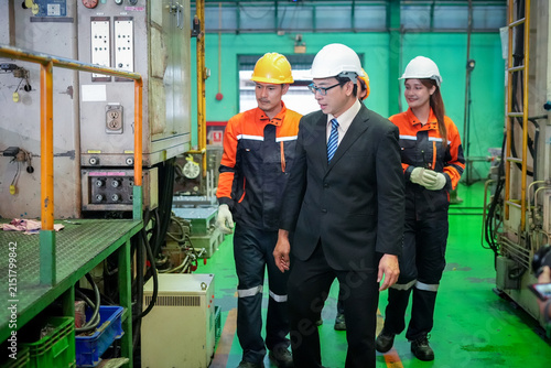фотографія Factory industrial engineer manager inspection safety machinery helmet business