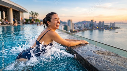 A young woman smiling in a pool with water massage jets on the back at sunset