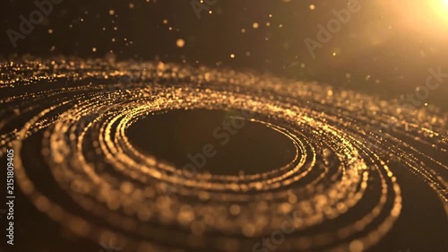Abstract golden particles swirling in a dark circular motion pattern
