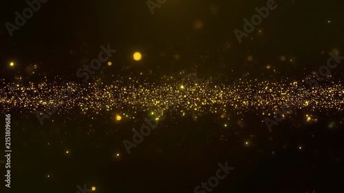 Golden dust particles flowing with subtle bokeh against a dark background for luxury events
