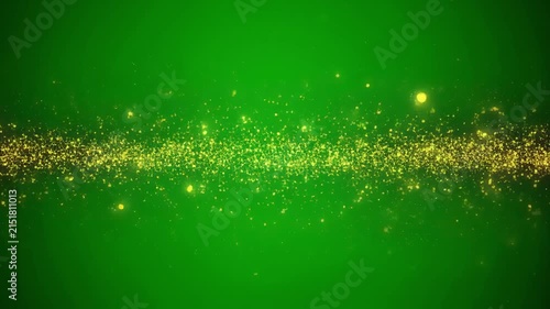 Golden dust particles trail across a vibrant green background with subtle bokeh effects