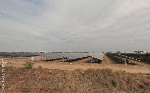 Medium long shot of six industrial team members walking abreast across an expansive