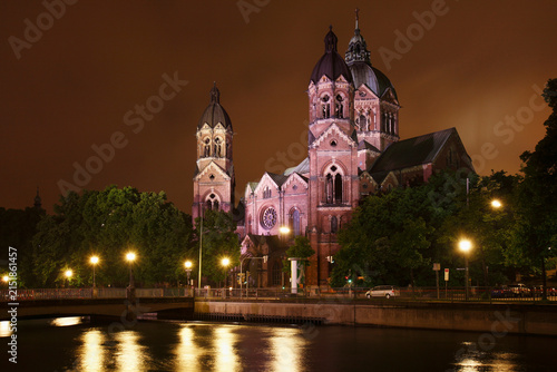 Germany, Bavaria, Munich, View of st lukas church by river isar at night