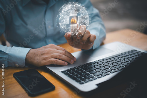 Close-up of businessman using laptop with floating AI command prompt and icons, representing artificial intelligence, prompt engineering, generative technology for digital transformation.