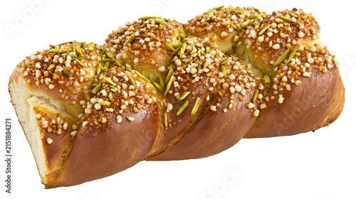Foto Braided sweet bread with nuts and sugar glaze