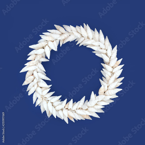 Auger seashell wreath on blue background. Decorative art seaside beautiful symbol for greeting card.

