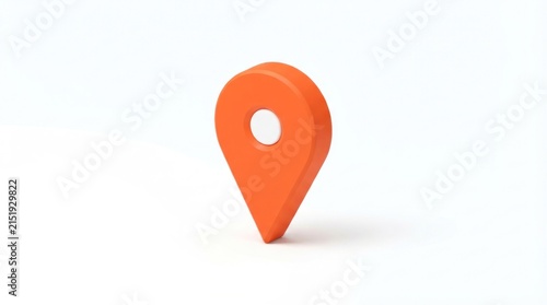 Bright orange location pin marker on white surface indicating travel destination.