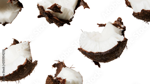 Bild auf Leinwand Broken coconut pieces with white flesh and brown fibrous husk