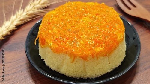 Foi Thong chiffon cake on a black plate