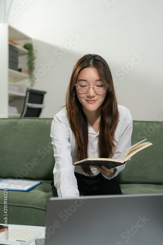 Business women are calculating daily expenses.