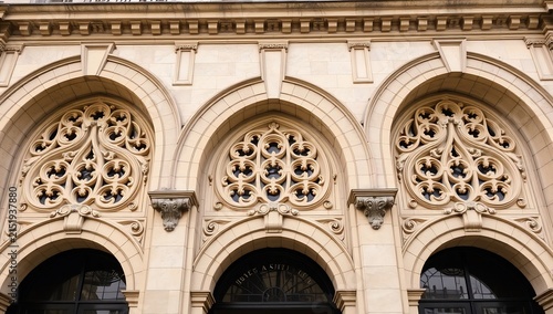 Ornate stone arches featuring intricate decorative tracery on a historic facade