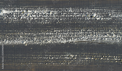 Photography Dark weathered wooden surface with peeling white paint and crusty texture