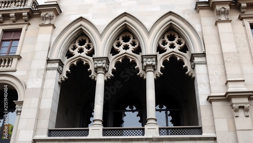 Ornate gothic revival stone arches on a historic building facade