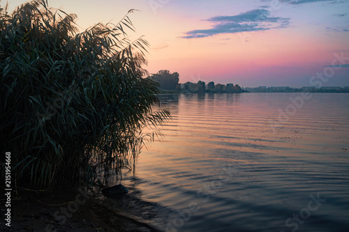 Cuadro en lienzo Haze over the river, warm summer evening