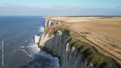 Drone aerial pull back shot of dramatic white chalk cliffs coastline in Yorkshire