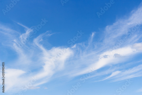 Cuadro en lienzo Whimsical wispy cirrus clouds drifting across a vibrant azure sky, creating eleg