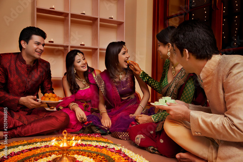 Woman feeding her friend sweets