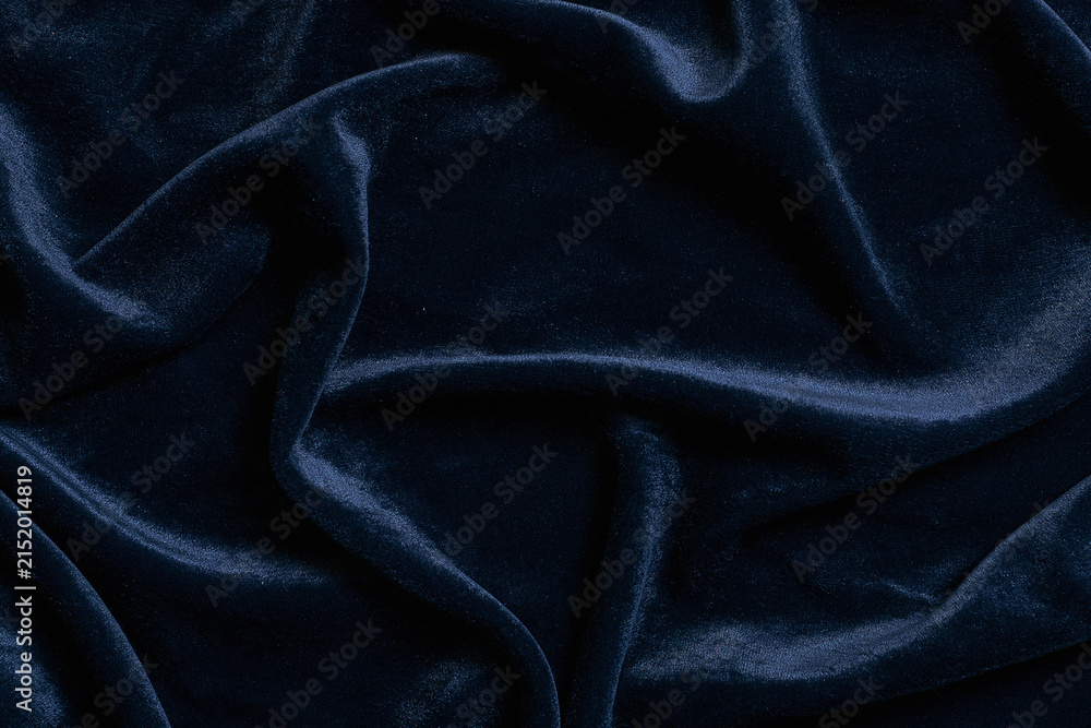 Obraz premium Luxury navy blue velvet fabric background texture with soft folds