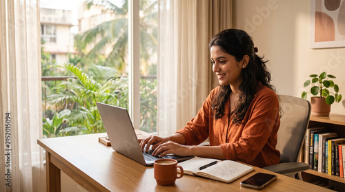 Young Indian Woman Working from Home on Laptop at Modern Desk
