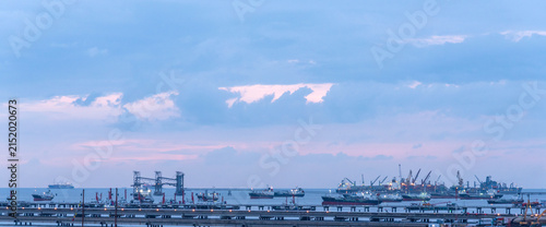 Cuadro en lienzo Industry landscape on sunset Engineering shipping crane depot at logistic export terminal control