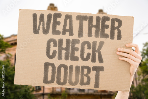 Foto "Weather check doubt" Repeatedly looking at the forecast does not remove indecision