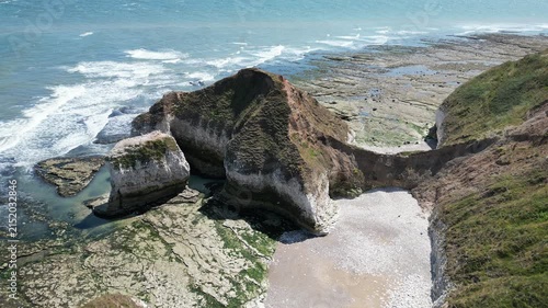 Static aerial view of The Drinking Dinosaur rock formation at Flamborough Head, England