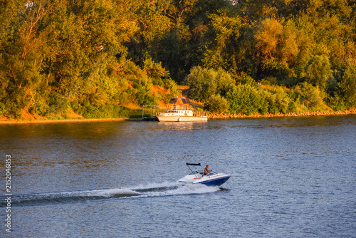 Panorama of the Tisza river at sunset, during a sunny evening. The riverbank of Szeged, Hungary. Tisza, or Tisa, is the main hungarian river.