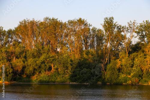 Quadro su tela Panorama of the Tisza river at sunset, during a sunny evening