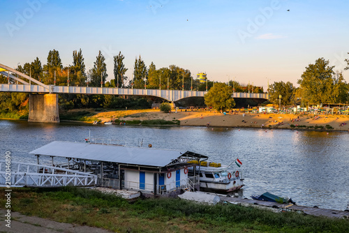 Panorama of the Tisza river at sunset, during a sunny evening. The riverbank of Szeged, Hungary. Tisza, or Tisa, is the main hungarian river.