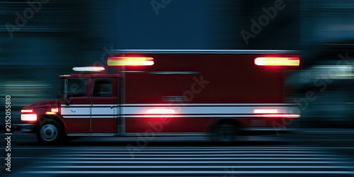 Red emergency vehicle in motion at night with blurred background