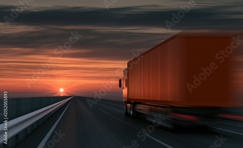 Truck drives down highway into sunset, motion blurred