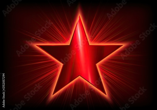 A glowing red star with radiating light beams on a dark background