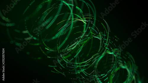 Green spiral particle trails on a dark background with dotted circular paths and soft glowing depth. Abstract technology image for energy flow, digital motion, signal visualization and futuristic scie