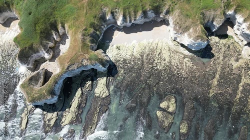 Static top down view of rugged chalk cliffs and sea caves at Flamborough, England
