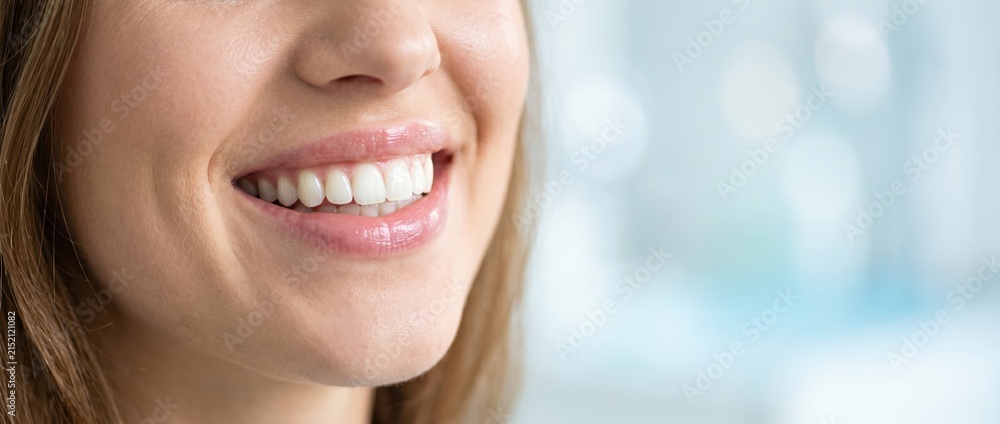 Obraz premium Close-up of a Beautiful Womans Radiant Smile with Perfect White Teeth.