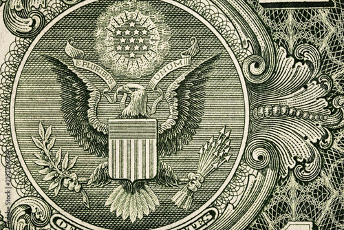 Macro detail of the Great Seal on a one-dollar banknote. Engraved eagle, shield, stars and ornamental linework in close-up.