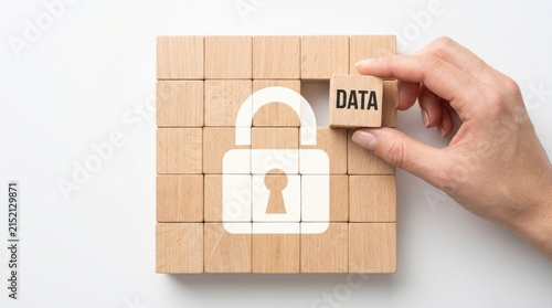 Hand placing wooden block with Data label to complete a digital security padlock icon