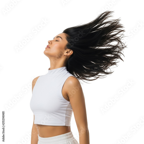 Young woman with curly hair flipping her head back