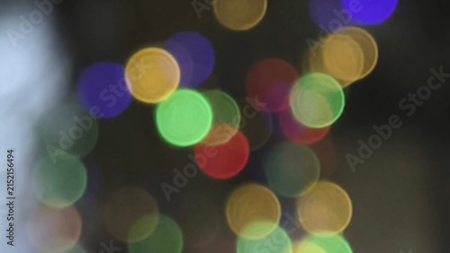 Beautiful abstract colorful bokeh light background from blurry multi-colored string lights glowing at night, ideal for festive celebrations, creative overlays, and decorative backdrops.