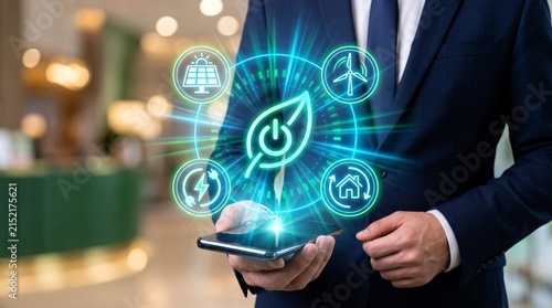 Professional businessman in dark suit holding smartphone displays glowing green environmental icons representing sustainable energy solutions and modern green technology innovations