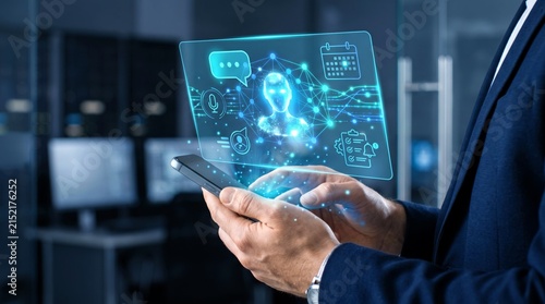 Professional man holding smartphone displays glowing blue digital holographic interface featuring artificial intelligence avatar icons and floating modern graphical data elements