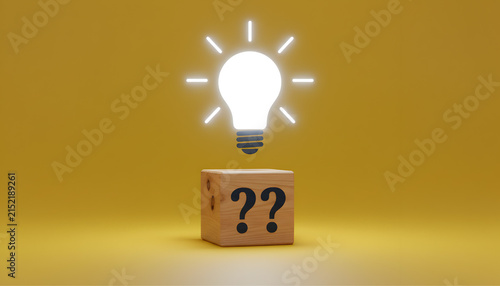 Bright light bulb icon on wooden cube representing innovative ideas